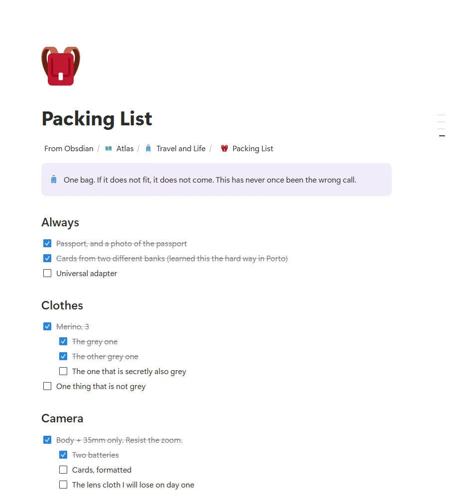 A Notion page with a purple callout and nested to-do items, some ticked and struck through.